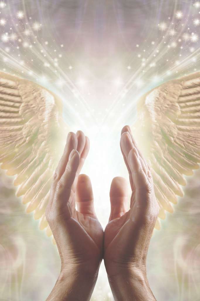 hands working with divine energy to offer guidance and light